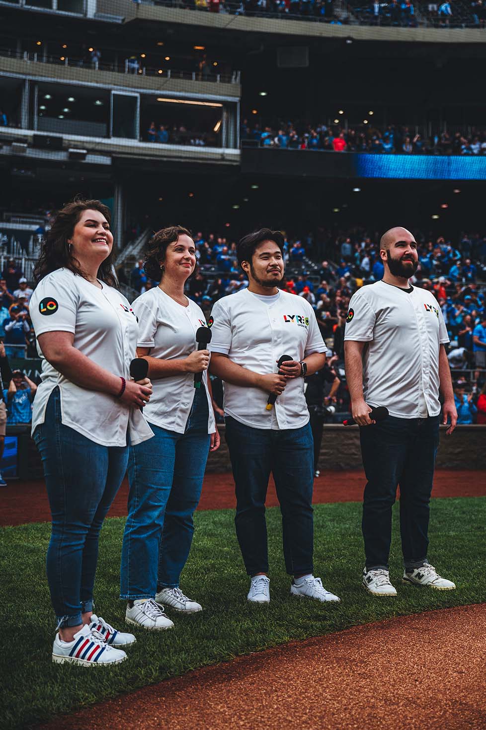 Resident Artists Bethany Jelinek, Virginia Reed, Daniel J. Lee, and Alex Smith singing the National Anthem before a KC Royals game