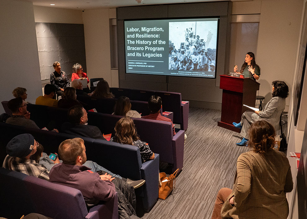 Dr. Sandra I. Enríquez giving a lecture at Community Conversation: The Voice of Your Heart at The Museum of Kansas City, photo by Andrew Schwartz