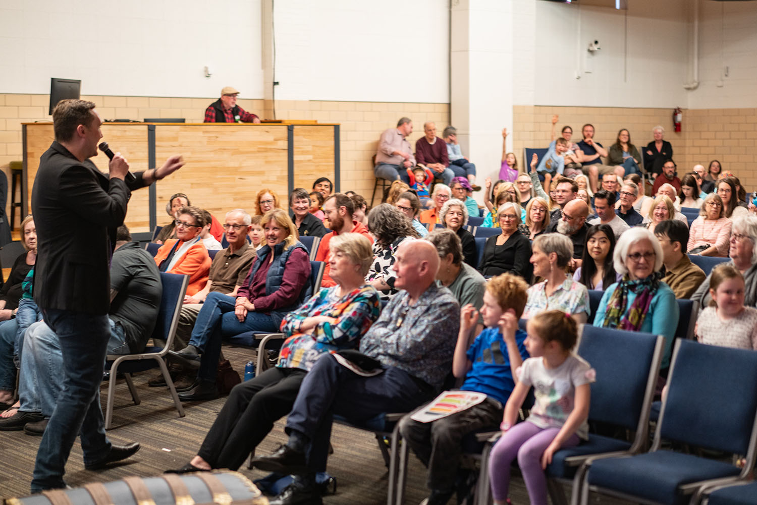 Director of Learning Dr. Neal Long engaging with the crowd at community performance of Maya and the Magic Ring, photo by Andrew Schwartz