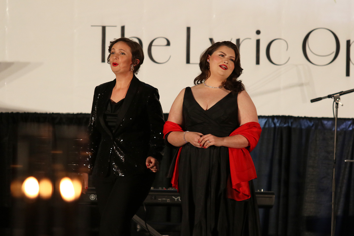 Resident Artists Virginia Reed and Bethany Jelinek singing at the 2025 Lyric Opera Ball, photo by David Riffel