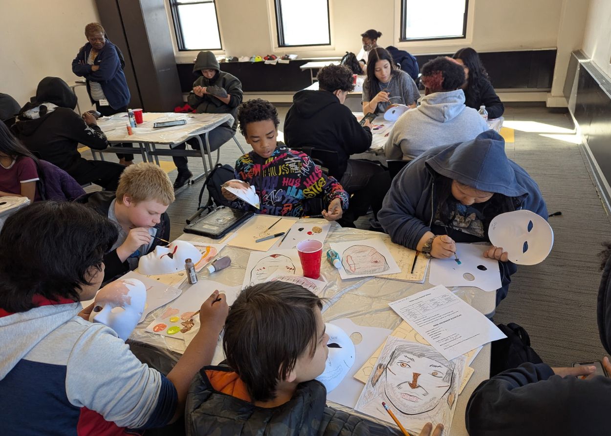 Students working on makeup skills