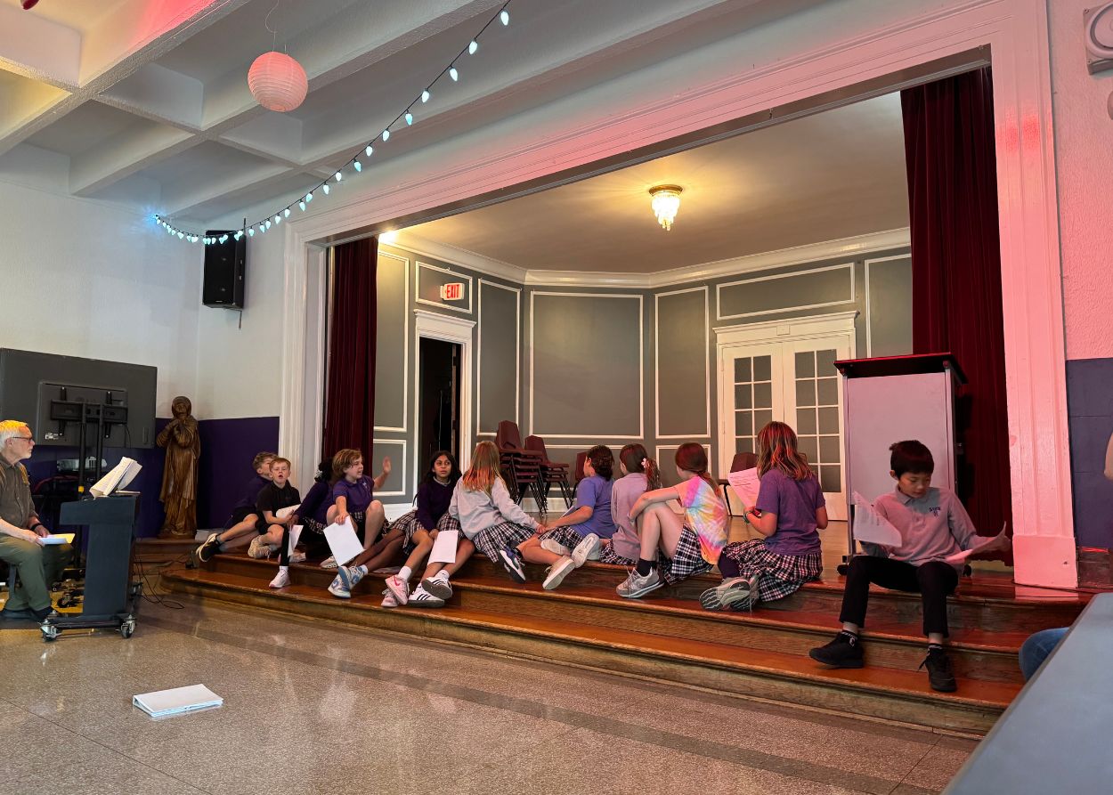Students taking a break from rehearsal during